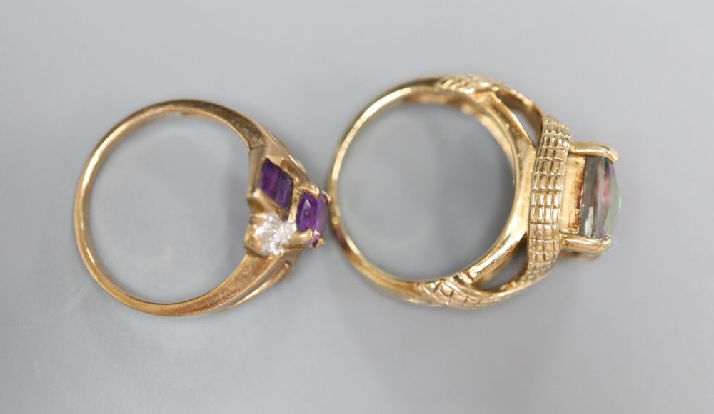 A 9ct gold and tourmaline? dress ring with fancy mount and a 9ct gold, amethyst and diamond crossover ring, gross 10.7g